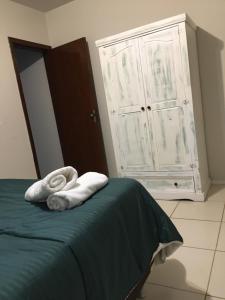 Säng eller sängar i ett rum på Pousada Caminhos Do Mar