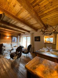 a living room with a couch and a table at On the pistes of Sauze in Sauze dʼOulx