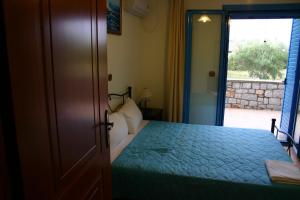 Postel nebo postele na pokoji v ubytování Porto Ageranos Apartment
