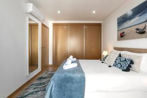 En eller flere senge i et værelse på Zahra Place - Stylish Flat