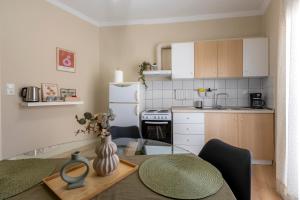 a small kitchen with a table and a dining room at Korte Apartment 2 in Arta