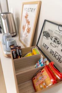 a wooden box filled with different types of snacks at Korte Apartment 2 in Arta