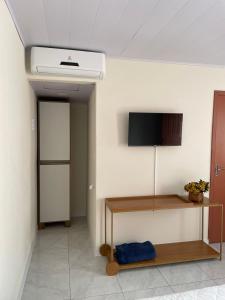 A television and/or entertainment centre at Conves suites