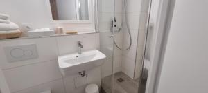 Um banheiro em Hotel De L'Europe
