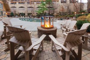 a group of chairs sitting around a table with a lantern at Holiday Inn Club Vacations Smoky Mountain Resort in Gatlinburg