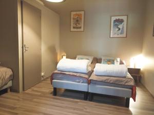 En eller flere senge i et værelse på Le gite des Mousquetaires