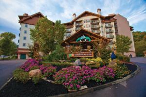 a hotel with flowers in front of a building at Holiday Inn Club Vacations Smoky Mountain Resort in Gatlinburg