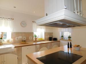 a kitchen with a sink and a stove top oven at Lea in Samobor