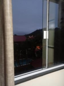 a window with a view of a building at Residencial Vovó Luiz in Florianópolis