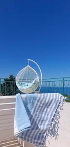 a bench with a towel sitting on top of it at Boutique Home Saltaragazza in Petrovac na Moru