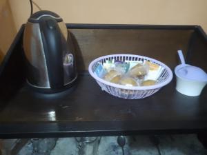 a bowl of food sitting on a table next to a blender at Trinidad Hostal in San Salvador de Jujuy