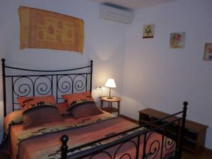 a bedroom with a bed and a table with a lamp at beautiful views with pool in ibiza in Sant Miquel de Balansat