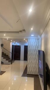 a hallway of a building with a staircase and a wall at شقة تنويه ليست للايجار in Al Khobar