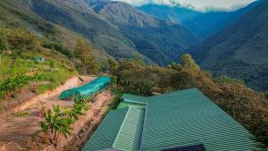 an aerial view of a water slide in the mountains at Ecoterra Inka Lodge in Quillabamba