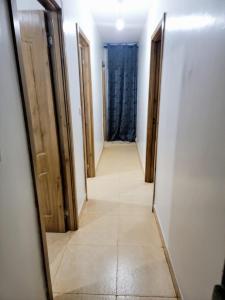 a hallway with two doors and a mirror at Unity Homes G in Eldoret