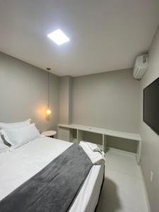 Tempat tidur dalam kamar di Casa Amora