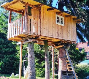 a tree house sitting on top of two trees at U nás Čicmany in Čičmany