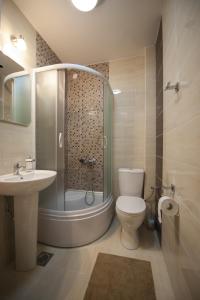 Et badeværelse på Benvenuti Apartments