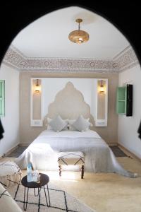 Postel nebo postele na pokoji v ubytování Riad Chic