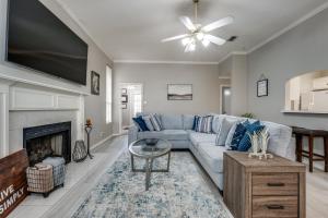 a living room with a couch and a fireplace at Spacious Brick House 3BR 2BA A+ in Denton