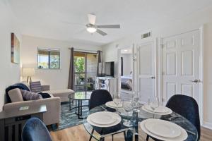a living room with a table and chairs at Peaceful Treetop Condo - 2br/2ba in Hilton Head Island