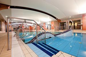 a swimming pool on a cruise ship at Łeba Hotel & Spa in Łeba