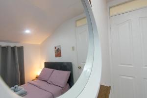 Postel nebo postele na pokoji v ubytování Whitehaus BnB