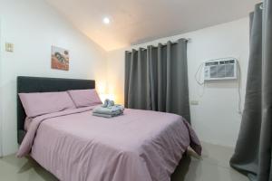 Postel nebo postele na pokoji v ubytování Whitehaus BnB