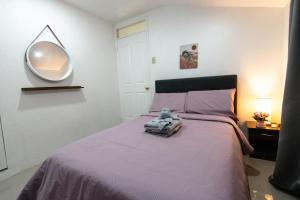 Postel nebo postele na pokoji v ubytování Whitehaus BnB