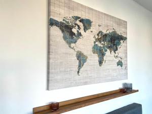 a map of the world on a wall at Chic Retreat: 2-Bed 1 Ensuite Oasis in Birmingham