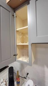 a white cabinet in a kitchen with a sink at Elegant Luxury 2BR Apt Near DTLA in Los Angeles