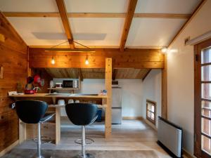 a kitchen with wooden walls and wooden ceilings at Alpages - Vacation STAY 11100 in Myoko