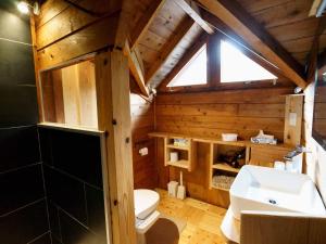a bathroom with a white toilet and a sink at Alpages - Vacation STAY 11100 in Myoko