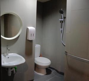 a small bathroom with a toilet and a sink at Fahrenheit Condo Bukit Bintang KL in Kuala Lumpur