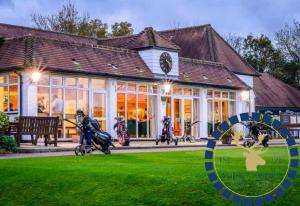 a group of people riding motorcycles in front of a building at Modern City Escape by TTLG Stays in Rickmansworth