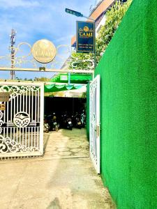 an entrance to a garage with a green wall at Lacami Dalat Hotel in Da Lat