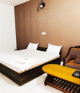 En eller flere senge i et værelse på THE GARDEN -- By SKY Group -- Special for Families, Couples, Corporate, Groups