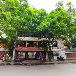 a group of motorcycles parked in front of a building at WISHTREE DORMITORY/CORPORATE DORMITORY FOR TECHIES AND TRAINEES in Chennai