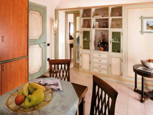 a kitchen with a table with a plate of fruit on it at Hotel Il Chiostro in Oppeano