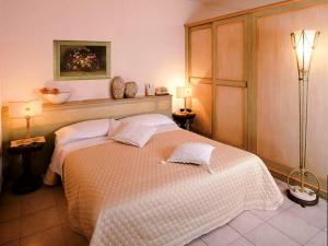 Postel nebo postele na pokoji v ubytování Hotel Il Chiostro