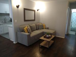 a living room with a couch and a table at Charming 1Bedroom Vacation Condo in Oceanside