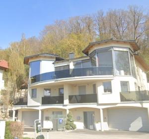 a large white building with a lot of windows at WernerS home in Sankt Florian bei Linz