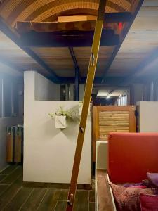 a living room with a red couch and a table at Hermosa Nests in Playa Hermosa +7 photos