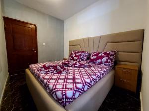 Un ou plusieurs lits dans un hébergement de l'établissement Appartement meublé Douala, 2-Bedroom Apartment -Kotto Bonamoussadi- Vanguard Apparts 302