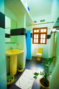 a bathroom with a sink and a toilet at rockwood vila in Kandy
