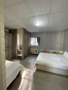 Ένα ή περισσότερα κρεβάτια σε δωμάτιο στο Yilan B&B +60 φωτογραφίες