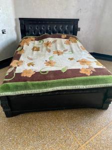 a bed with a blanket on top of it at North Africa Casablanca in Casablanca
