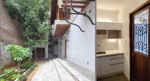 a kitchen and a hallway of a building with a window at Kariappa House in Pondicherry