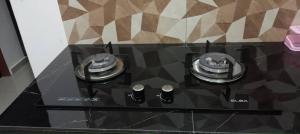 a stove top with two burners on a counter at D'NAS HOMESTAY - Muslm Only in Sungai Besar