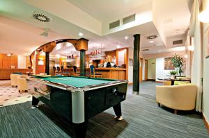 a billiard room with a pool table in it at Łeba Hotel & Spa in Łeba